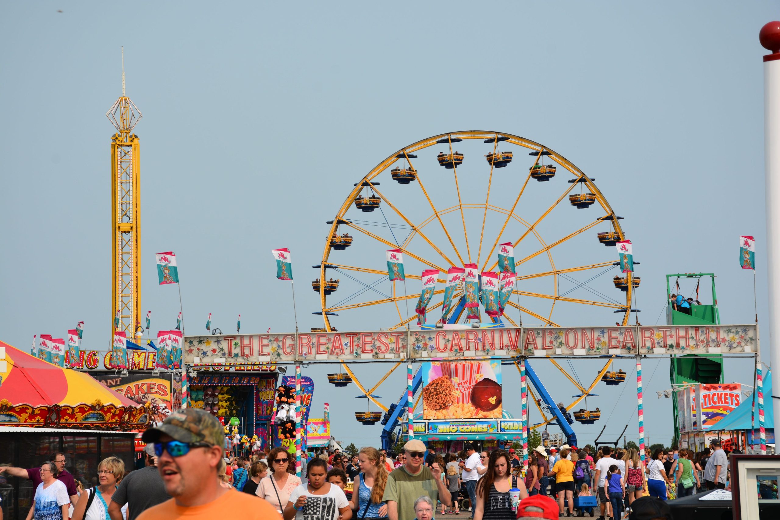 Ferris wheel and attractions at the Nebraska State Fair in Grand Island at sunset