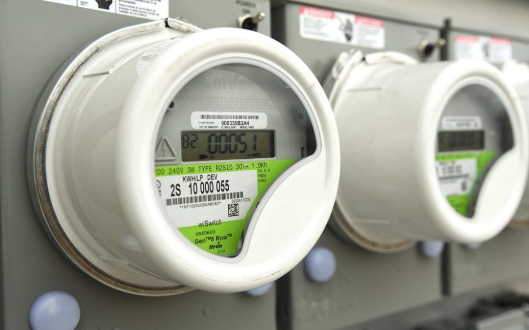 Electricity meters installed on the exterior wall of a residential building. OPPD Bills.